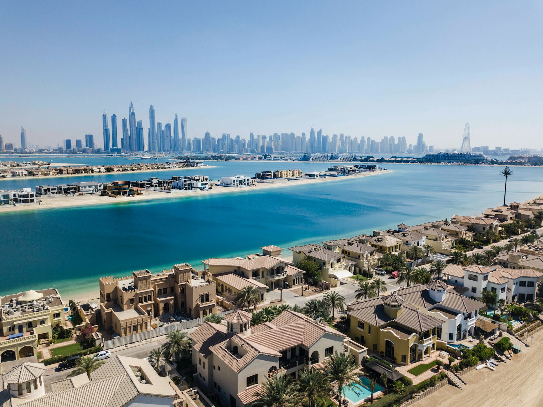 villas in front of skyscapers in dubai