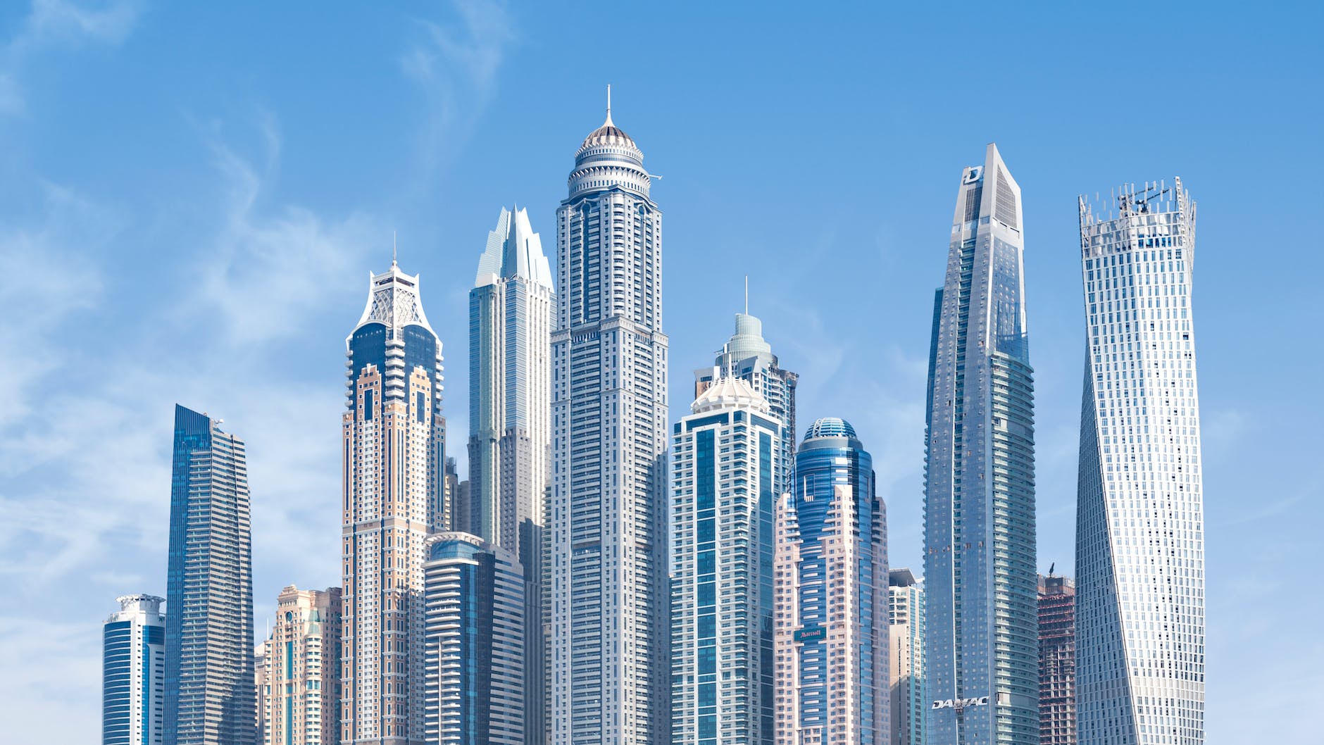 concrete high rise buildings under blue sky